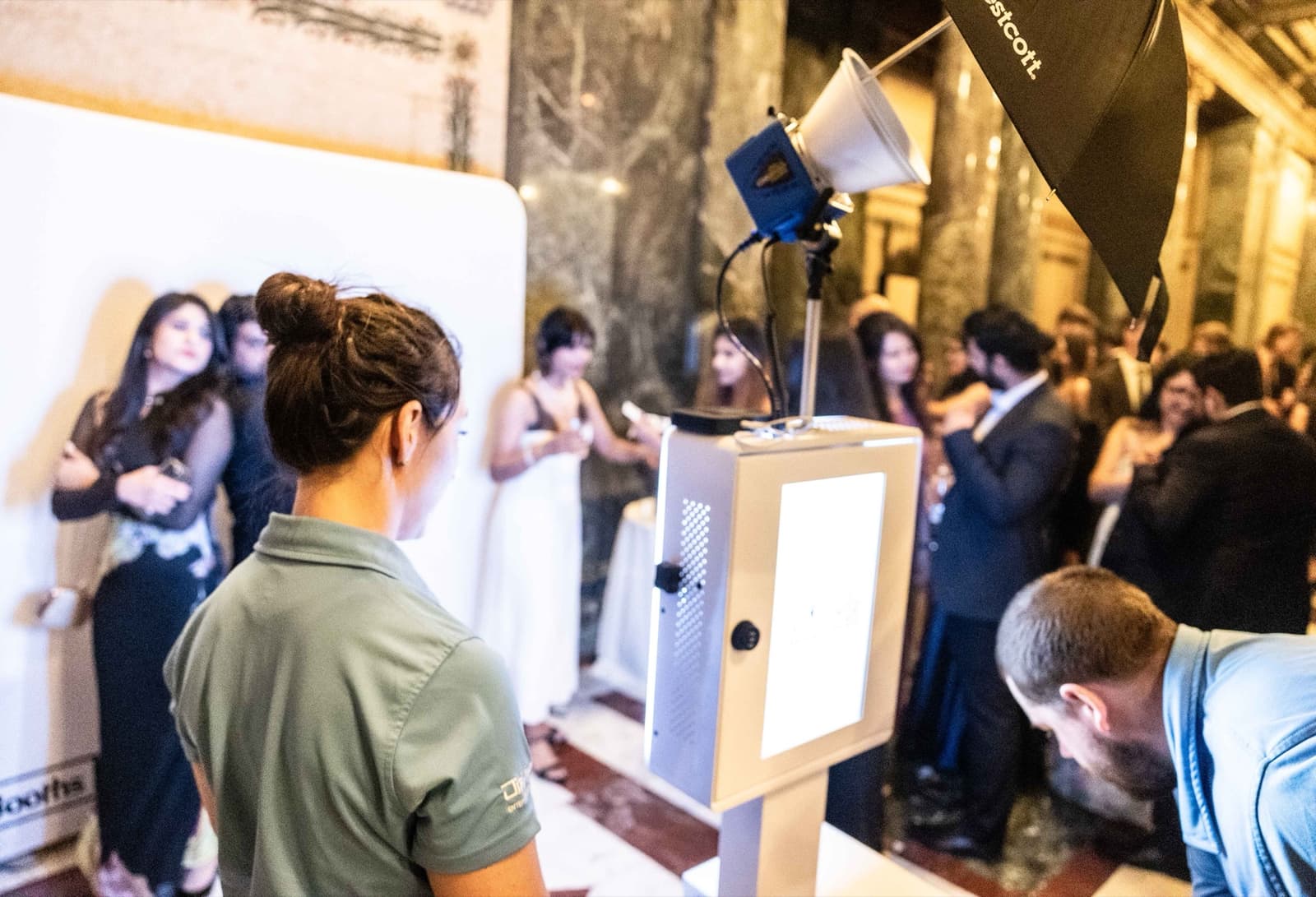 Photo experience setup inside the ornate marble hall of a museum gala.